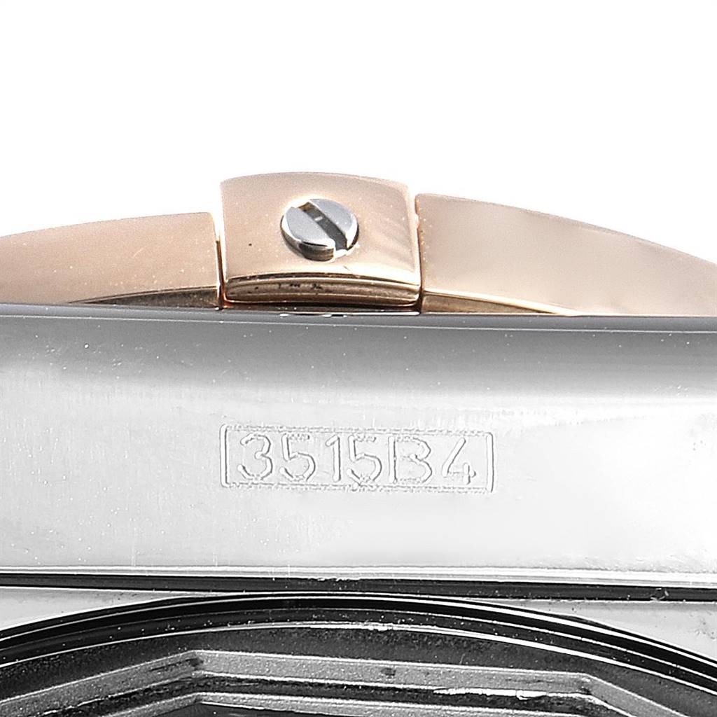 This is a close-up shot of a clasp and part of the watch band of a Breitling Chronomat CB042012/BB86 Men's Steel and Gold (two tone) Black Dial CB042012/BB86 Men's Steel and Gold (two tone) Black Dial model.