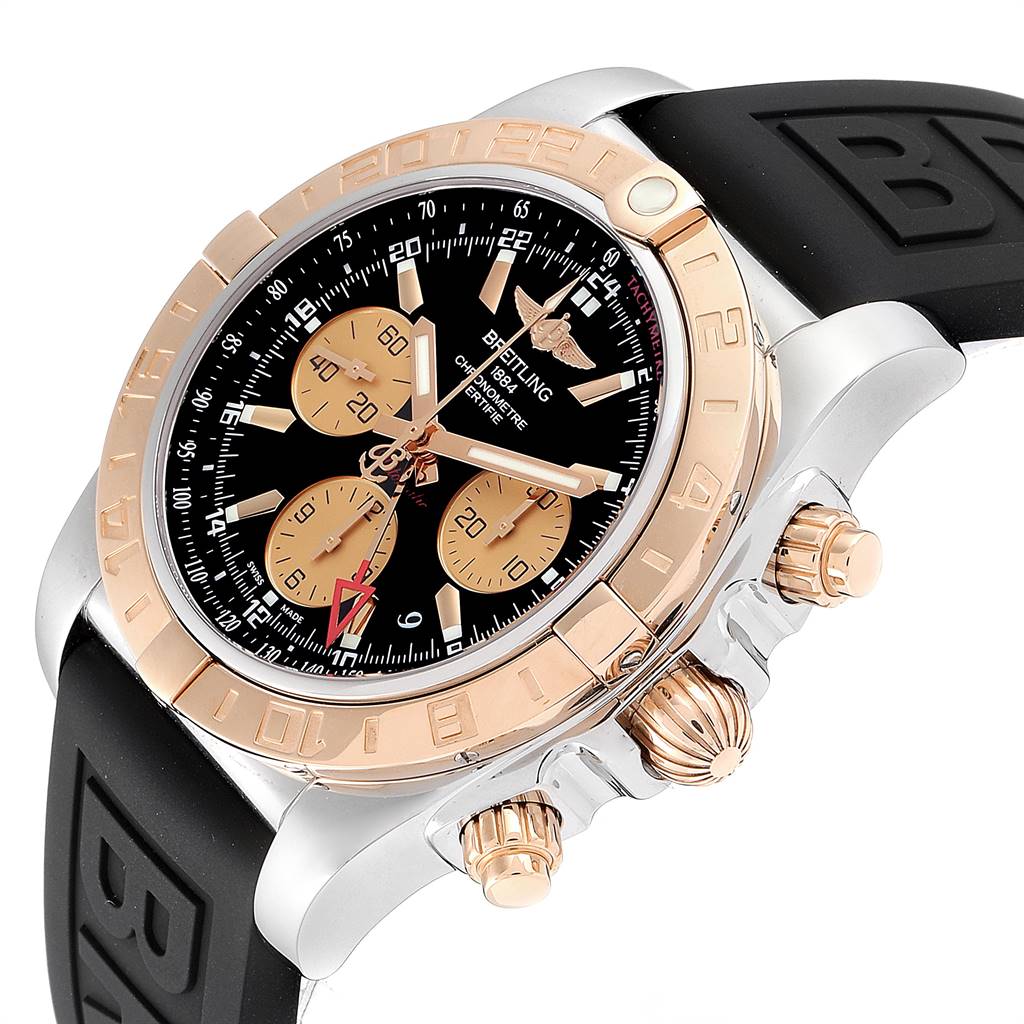 This image shows a Breitling Chronomat CB042012/BB86 Men's Steel and Gold (two tone) Black Dial CB042012/BB86 Men's Steel and Gold (two tone) Black Dial watch at a slight angle, highlighting the bezel, crown, pushers, and part of the strap.