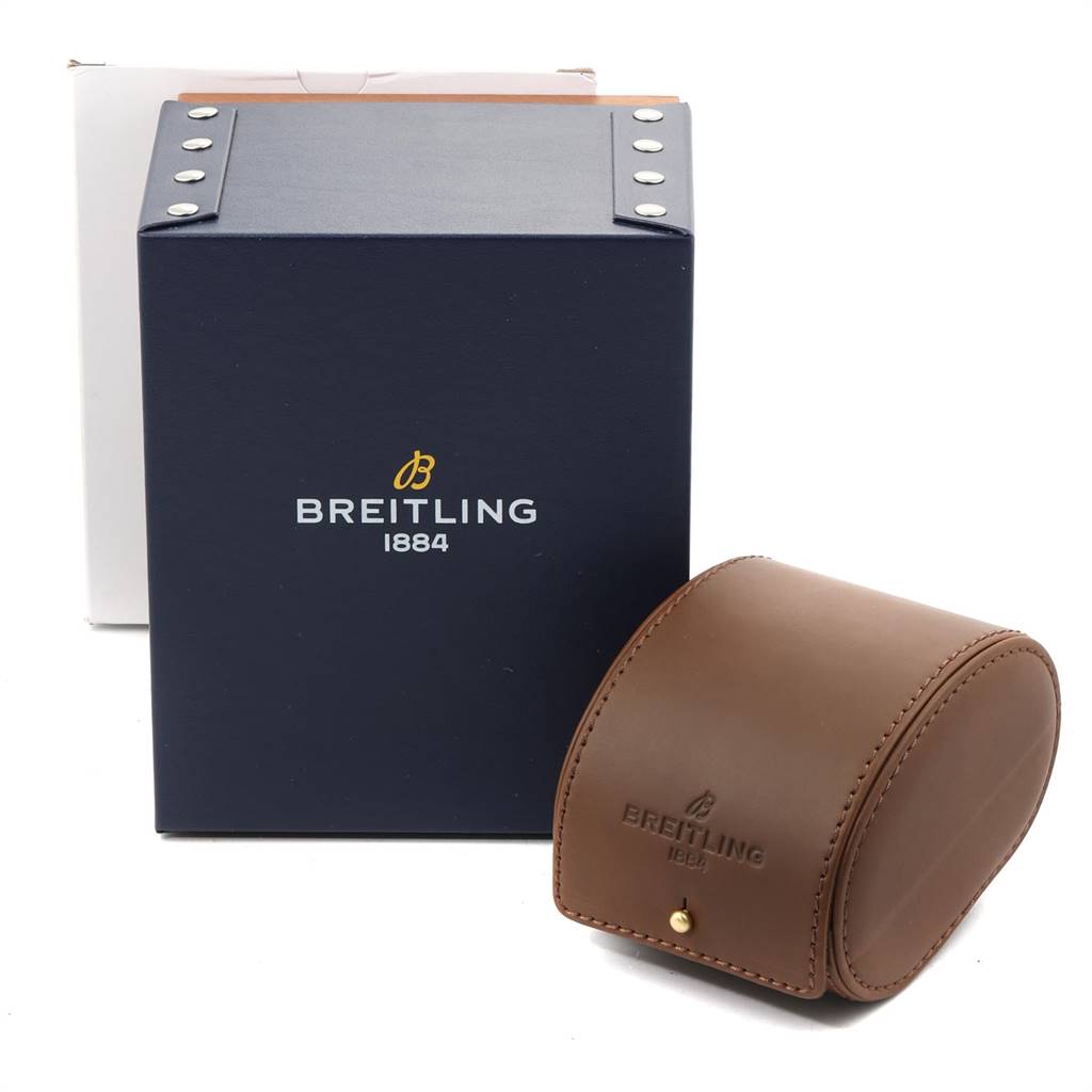 The image shows the Breitling Chronomat CB042012/BB86 Men's Steel and Gold (two tone) Black Dial CB042012/BB86 Men's Steel and Gold (two tone) Black Dial watch's packaging, including a blue box with silver rivets and a brown leather travel case.