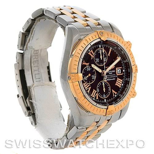 The image shows a side angle view of the Breitling Chronomat C1335611/K515-TT Men's Stainless Steel Burgundy Dial C1335611/K515-TT Men's Stainless Steel Burgundy Dial watch, highlighting the gold bezel, dial, and multi-link bracelet.