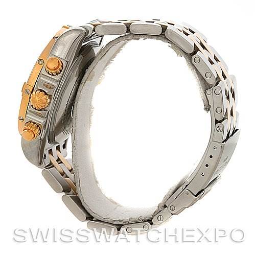 The image shows a side view of a Breitling Chronomat C1335611/K515-TT Men's Stainless Steel Burgundy Dial C1335611/K515-TT Men's Stainless Steel Burgundy Dial watch, highlighting its crown, pushers, and metal bracelet.