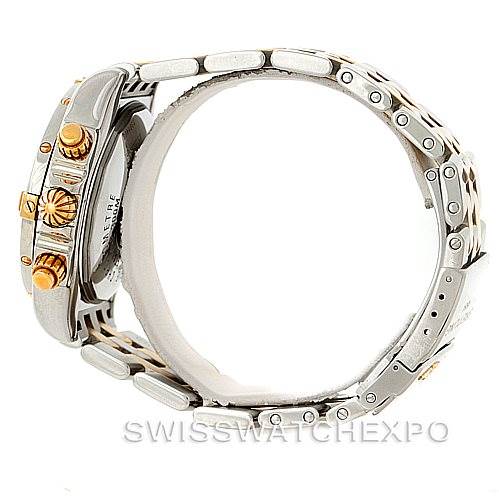 The image shows a side view of a Breitling Chronomat B13356 Men's Steel and Gold (two tone) Black Dial B13356 Men's Steel and Gold (two tone) Black Dial watch, highlighting the crown, pushers, and bracelet.