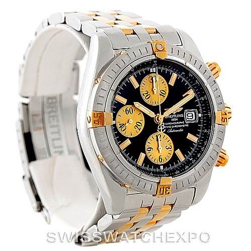 The image shows a Breitling Chronomat B13356 Men's Steel and Gold (two tone) Black Dial B13356 Men's Steel and Gold (two tone) Black Dial watch at an angled view, featuring its dial, bezel, and bracelet.