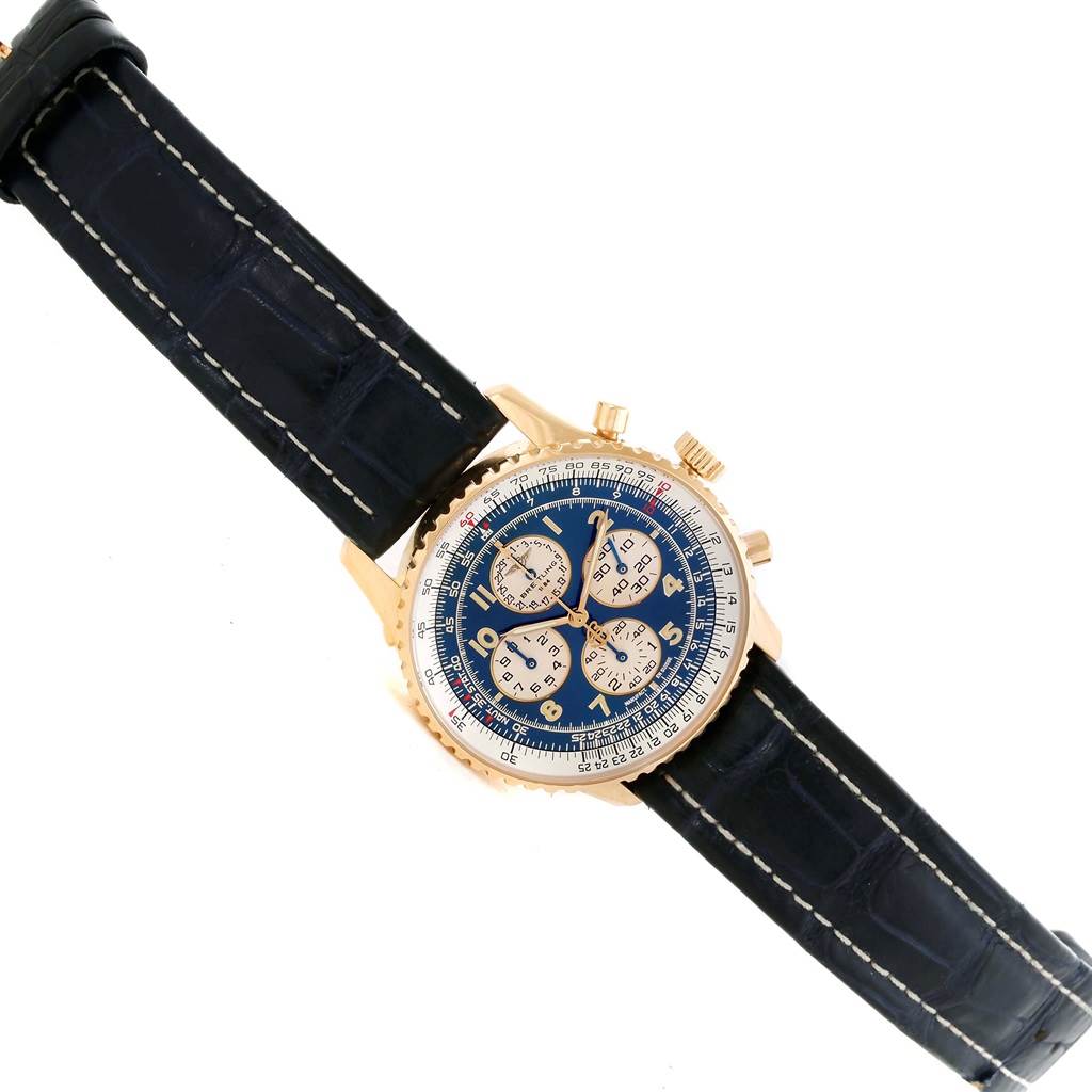 The Breitling Navitimer K33030 Men's Yellow Gold Blue Dial K33030 Men's Yellow Gold Blue Dial watch is shown at a slight angle from the front, displaying the case, dial, crown, pushers, and strap.