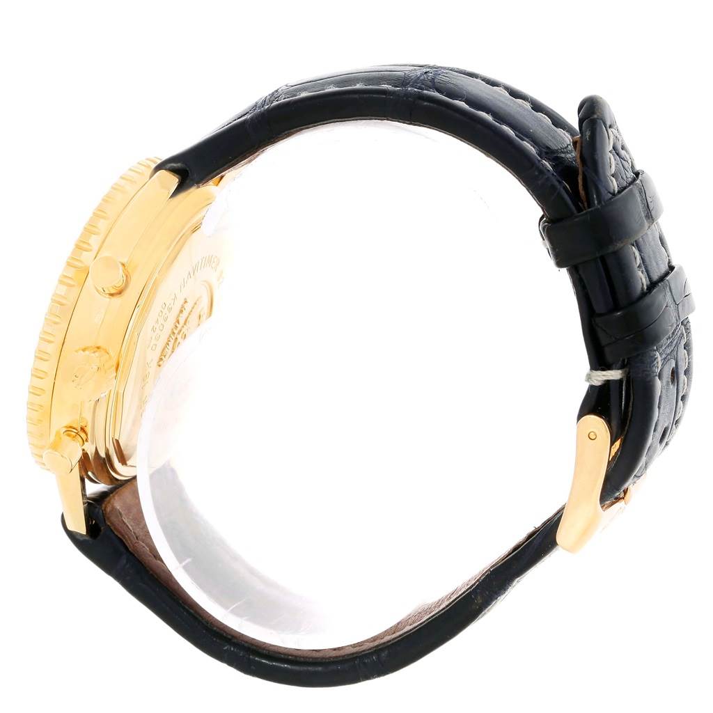 This image shows a side view of a Breitling Navitimer K33030 Men's Yellow Gold Blue Dial K33030 Men's Yellow Gold Blue Dial watch, highlighting its gold case and black leather strap.