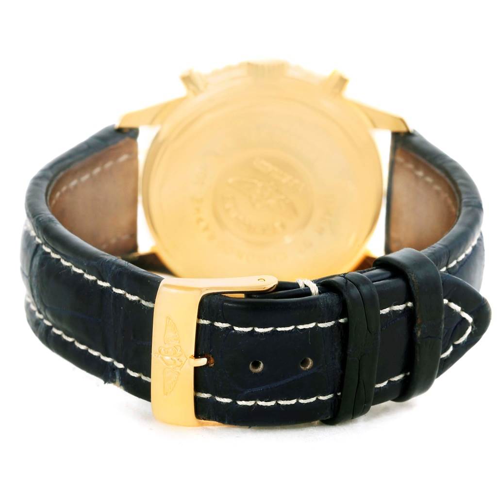 This image shows the back view of a Breitling Navitimer K33030 Men's Yellow Gold Blue Dial K33030 Men's Yellow Gold Blue Dial watch, highlighting the leather strap and gold buckle.