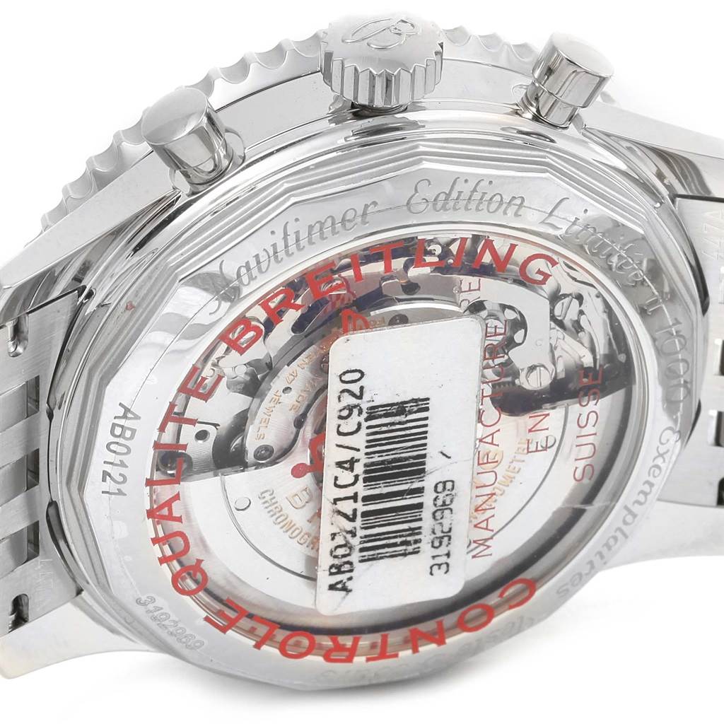 The image shows the back casing and crown of a Breitling Navitimer AB0121C4-C920-447A Men's Stainless Steel Blue Dial AB0121C4-C920-447A Men's Stainless Steel Blue Dial watch, highlighting its transparent case back.