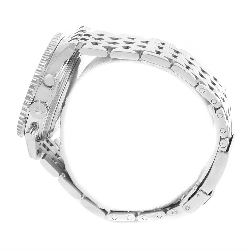 The image shows the side profile of a Breitling Navitimer AB0121C4-C920-447A Men's Stainless Steel Blue Dial AB0121C4-C920-447A Men's Stainless Steel Blue Dial watch, highlighting its metallic bracelet and the case with crown and pushers.