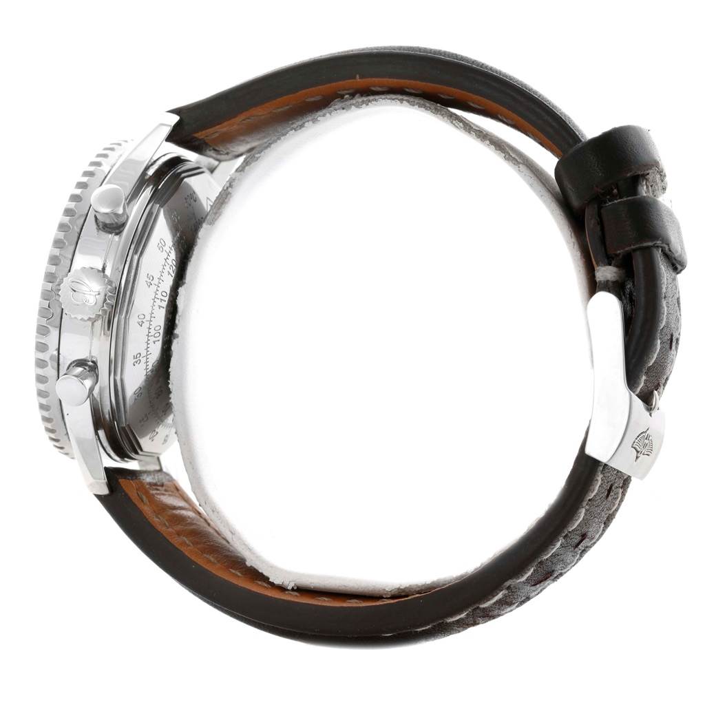 This side view of the Breitling Navitimer A23322 Men's Stainless Steel Silver Dial A23322 Men's Stainless Steel Silver Dial watch shows the crown, pushers, and leather strap with a buckle clasp.