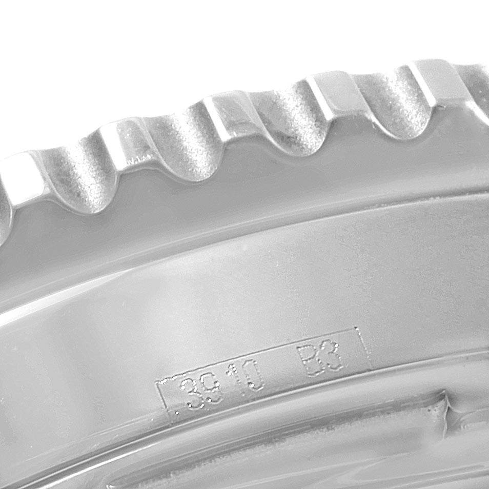 The image shows a close-up of the ridged bezel of a Breitling Navitimer A23322 Men's Stainless Steel Black Dial A23322 Men's Stainless Steel Black Dial watch model, focusing on the engraved edge detail.