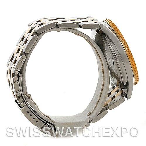 This image shows a side view of a Breitling Navitimer D13022 Men's Stainless Steel Blue Dial D13022 Men's Stainless Steel Blue Dial watch, highlighting its bracelet, clasp, and case.