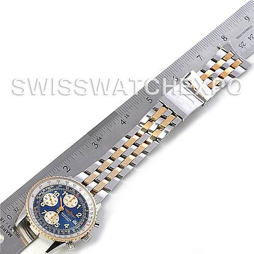 This image shows a Breitling Navitimer D13022 Men's Stainless Steel Blue Dial D13022 Men's Stainless Steel Blue Dial watch laid flat with a two-tone bracelet beside a ruler for scale.