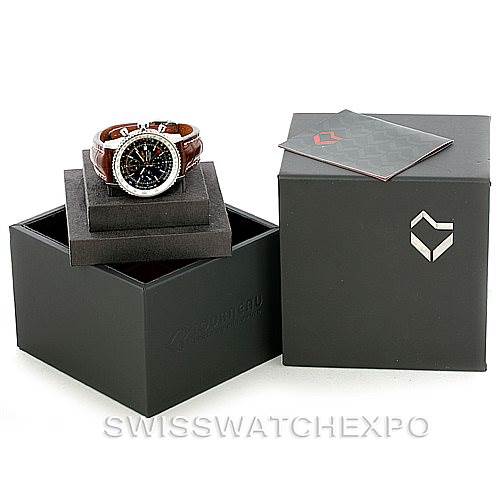The image shows a Breitling Navitimer A24322 Men's Stainless Steel Black Dial A24322 Men's Stainless Steel Black Dial watch from a front angle, displayed on a stand with its box and manual beside it.