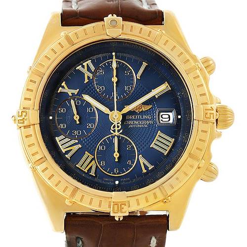The image shows a front view of a Breitling Windrider K13055 Men's Yellow Gold Blue Dial K13055 Men's Yellow Gold Blue Dial watch, highlighting its blue dial, gold case, and brown leather strap.