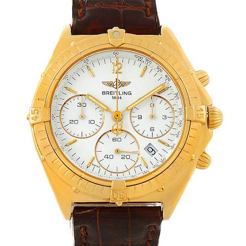 The image shows a front view of the Breitling Windrider K55046 Men's Yellow Gold White Dial K55046 Men's Yellow Gold White Dial watch with a gold bezel and brown leather strap.