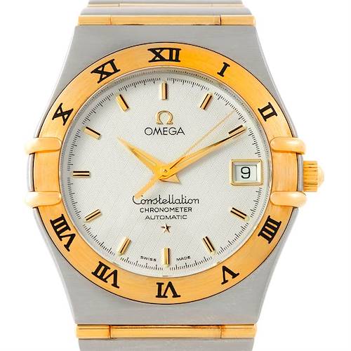 This image shows a close-up, front view of an Omega Constellation 1202.30.00 Men's Steel and Gold (two tone) Silver Dial 1202.30.00 Men's Steel and Gold (two tone) Silver Dial Chronometer Automatic watch, highlighting its dial and bezel.