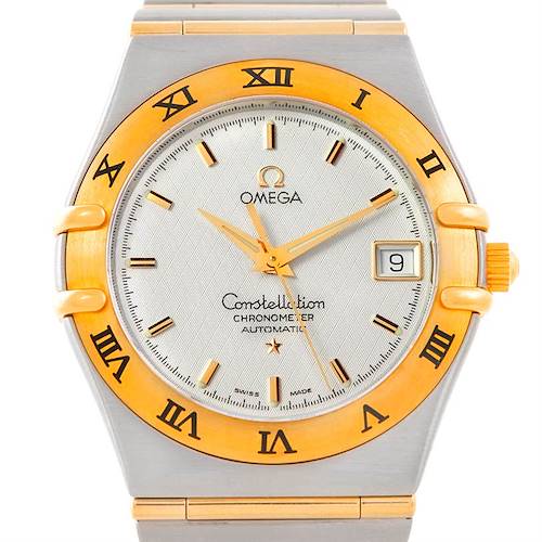 The image shows a frontal view of an Omega Constellation 1202.30.00 Men's Steel and Gold (two tone) Silver Dial 1202.30.00 Men's Steel and Gold (two tone) Silver Dial watch, highlighting its gold bezel, Roman numerals, and date display.
