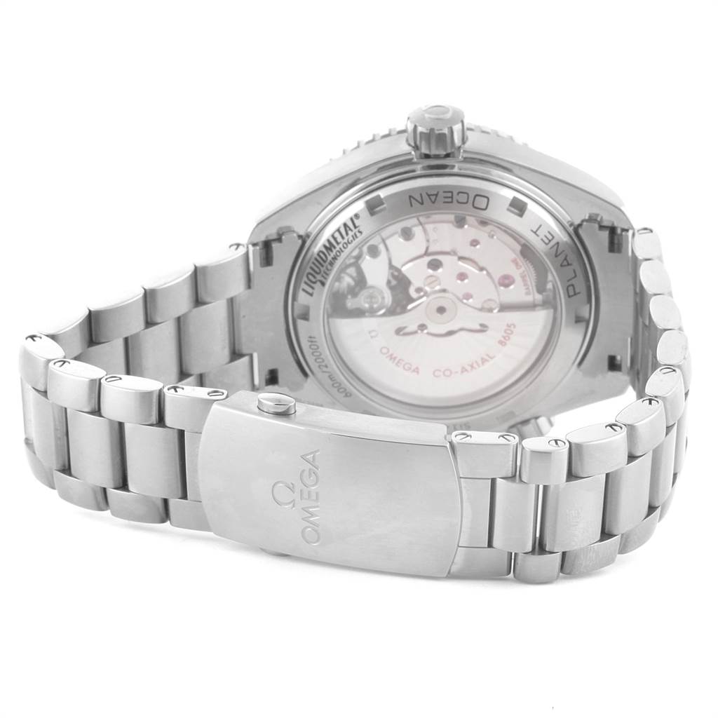 The image shows the back view of an Omega Planet Ocean 232.90.44.22.03.001 Men's Titanium Blue Dial 232.90.44.22.03.001 Men's Titanium Blue Dial watch, highlighting the transparent case back and the metal bracelet.