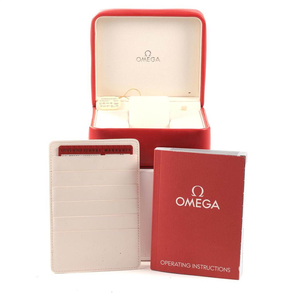 The image shows the box, warranty cardholder, and operating instructions for an Omega Planet Ocean 232.90.44.22.03.001 Men's Titanium Blue Dial 232.90.44.22.03.001 Men's Titanium Blue Dial watch.