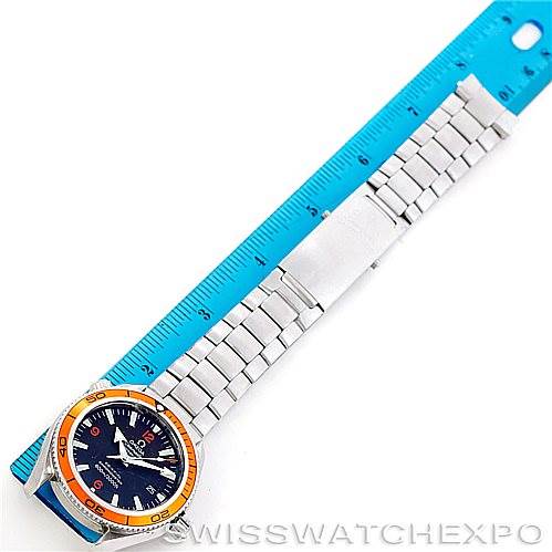 The Omega Planet Ocean 2209.50.00 Men's Stainless Steel Black Dial 2209.50.00 Men's Stainless Steel Black Dial watch is shown at a top-down angle with its full length beside a blue ruler.