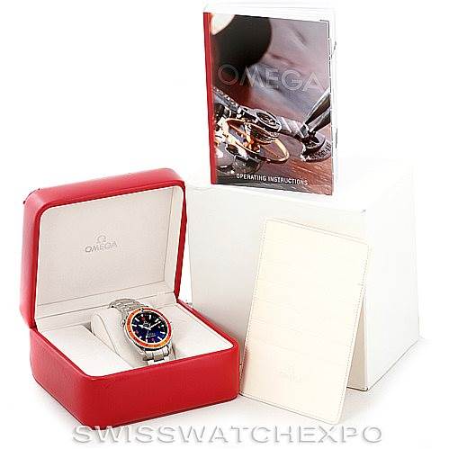 The image shows an Omega Planet Ocean 2209.50.00 Men's Stainless Steel Black Dial 2209.50.00 Men's Stainless Steel Black Dial watch in its red case, accompanied by an operating instructions manual and additional paperwork.