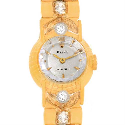This image shows a Rolex Cocktail 8271 Women's Yellow Gold Silver Dial 8271 Women's Yellow Gold Silver Dial model watch from a top-down angle, focusing on the dial, crown, and part of the strap adorned with diamonds.