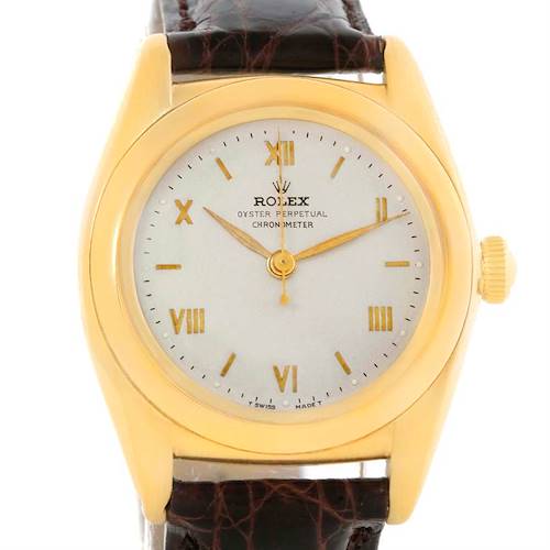 The image shows a front view of a Rolex Vintage Collection 3131G Men's Yellow Gold Silver Dial 3131G Men's Yellow Gold Silver Dial watch, highlighting its face, hands, and leather strap.