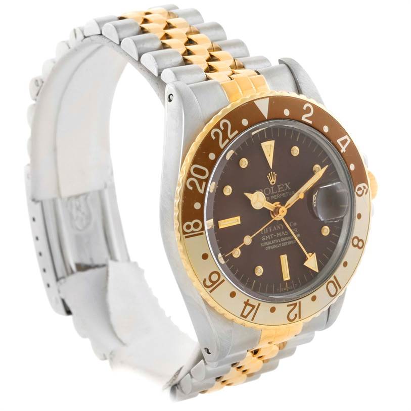 This Vintage Collection Rolex watch is shown from a left-side angle, displaying the dial, bezel, and bracelet.
