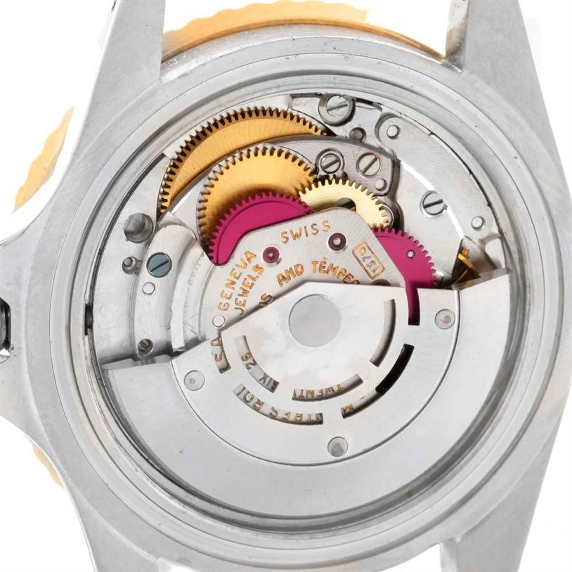 The image shows the internal mechanism of the Rolex Vintage Collection 1675 Men's Stainless Steel Brown Dial 1675 Men's Stainless Steel Brown Dial watch from a rear angle, revealing its gears and components.