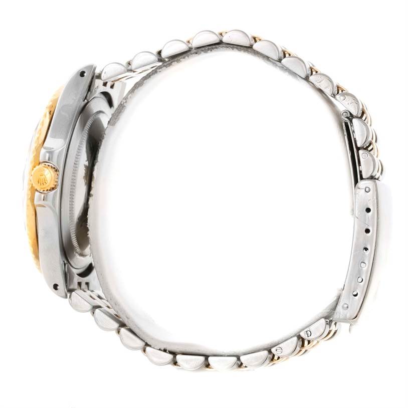 This side view of the Rolex Vintage Collection 1675 Men's Stainless Steel Brown Dial 1675 Men's Stainless Steel Brown Dial model shows the crown, case, and part of the bracelet.