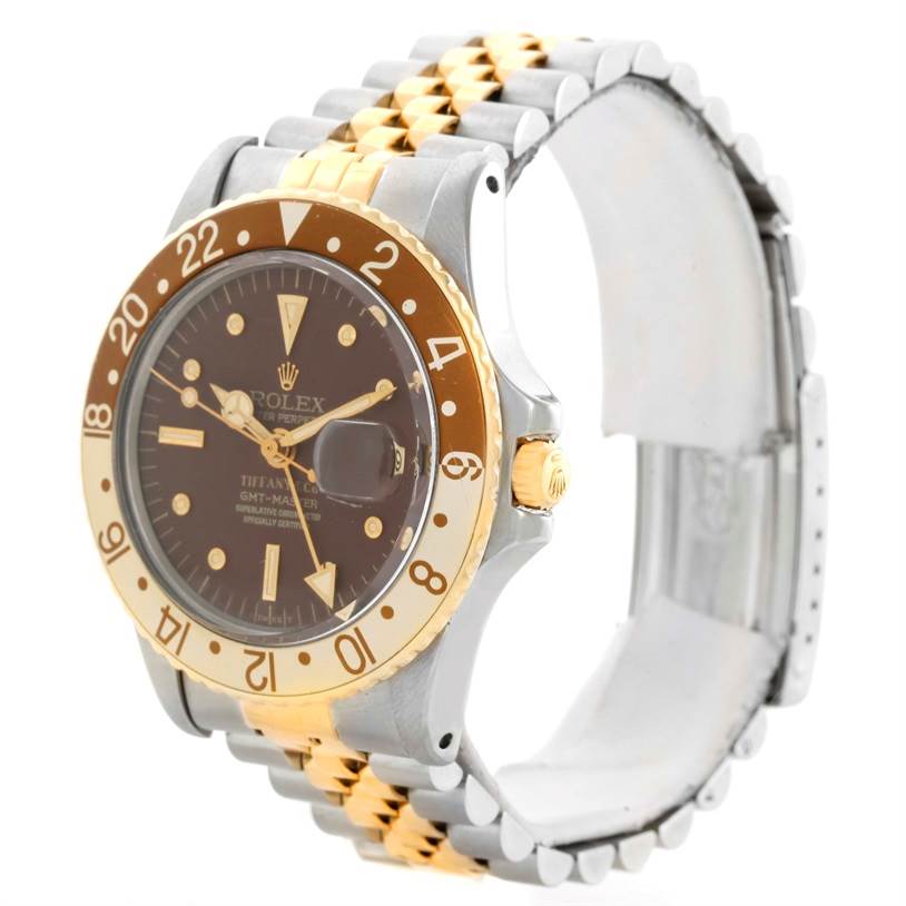 This image shows a Rolex Vintage Collection 1675 Men's Stainless Steel Brown Dial 1675 Men's Stainless Steel Brown Dial GMT-Master watch from an angled side view, highlighting the face, bezel, and part of the bracelet.