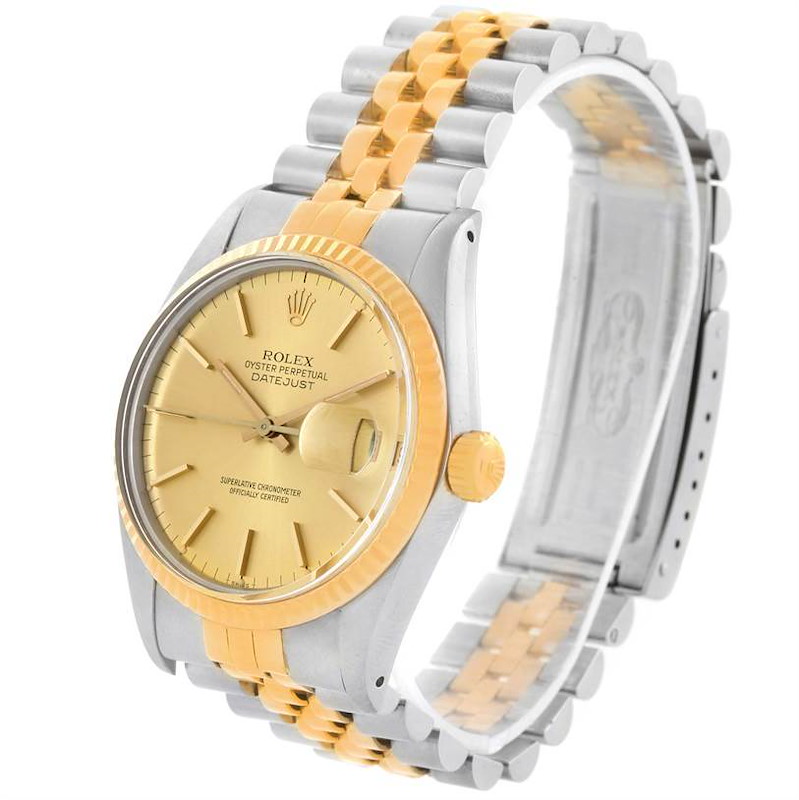 The image shows a Rolex Vintage Collection 16013 Men's Stainless Steel Champagne Dial 16013 Men's Stainless Steel Champagne Dial watch, featuring its gold dial, two-tone bracelet, and gold fluted bezel at an angled view.