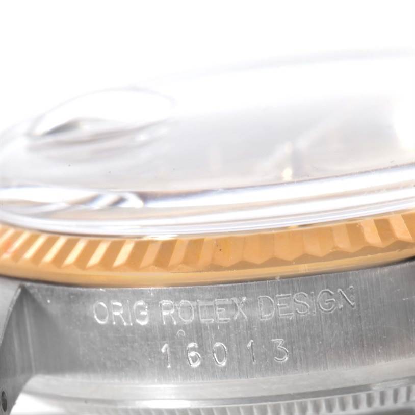 The image shows a close-up of the side of a Rolex Vintage Collection 16013 Men's Stainless Steel Champagne Dial 16013 Men's Stainless Steel Champagne Dial watch case with the engraved model number "16013."