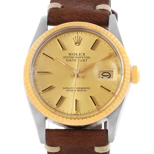 The image shows a Rolex Vintage Collection 16013 Men's Stainless Steel Champagne Dial 16013 Men's Stainless Steel Champagne Dial Oyster Perpetual Datejust watch, focusing on its face, bezel, and part of its leather strap.