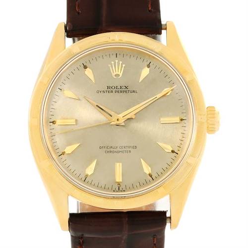 The image shows a front view of a Rolex Vintage Collection 6569 Men's Yellow Gold Brown Dial 6569 Men's Yellow Gold Brown Dial watch with a gold dial and brown leather strap.