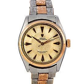 The Vintage Collection model by Rolex is shown from a front angle, highlighting its dial, bezel, crown, and bracelet.