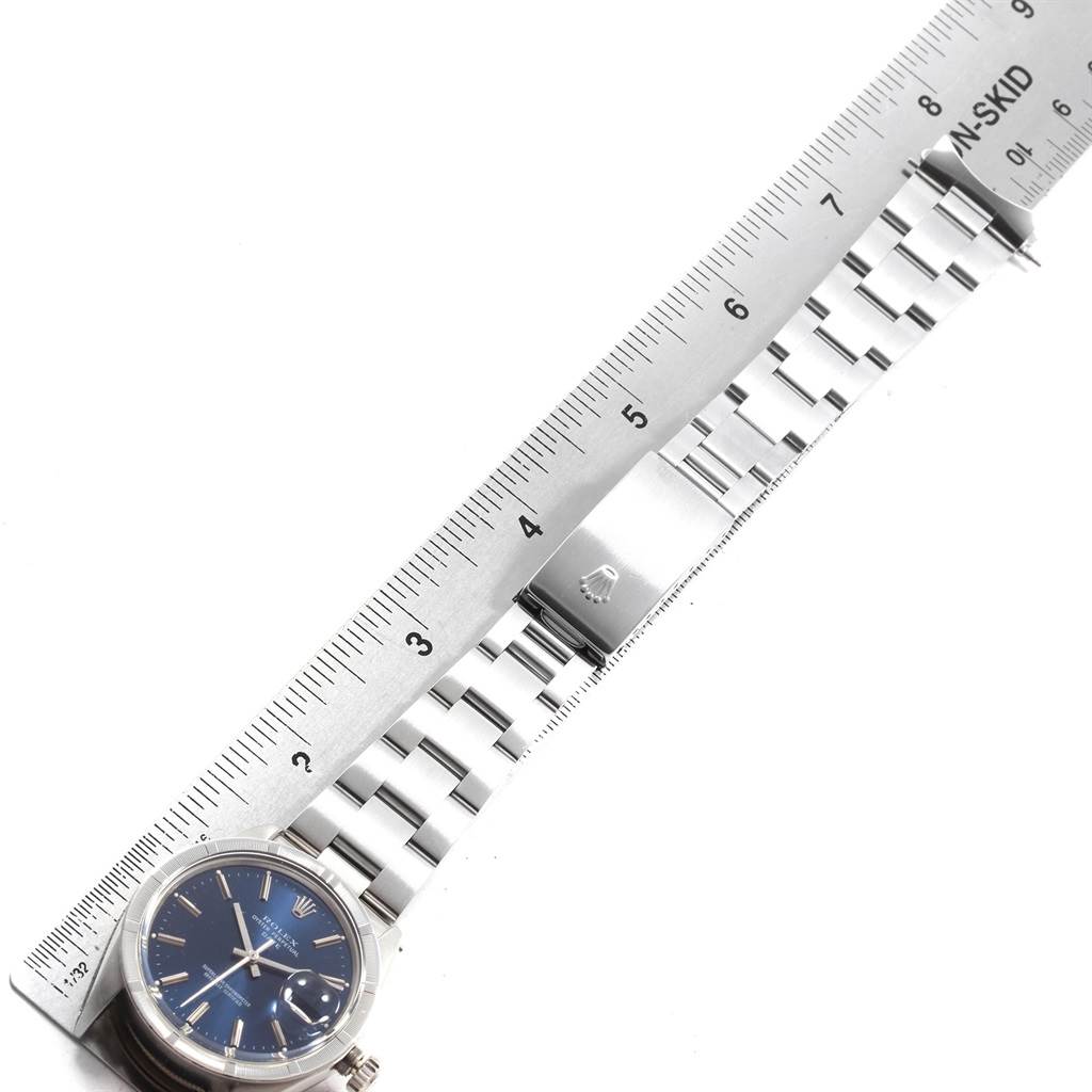 The image shows a Rolex Vintage Collection 1501 Men's Stainless Steel Blue Dial 1501 Men's Stainless Steel Blue Dial watch lying flat, with its face and metal strap measured against a ruler.