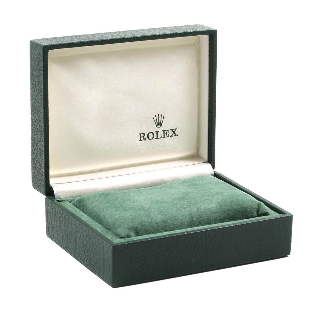 The image shows an open green Rolex watch box, possibly for the Vintage Collection model, with a white interior and a green cushion.