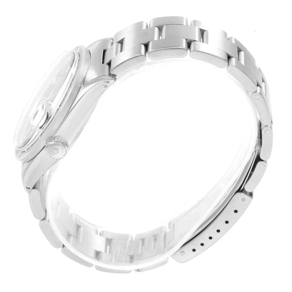 The image shows a side view of the Rolex Vintage Collection 1501 Men's Stainless Steel Blue Dial 1501 Men's Stainless Steel Blue Dial watch, highlighting its stainless steel case, bracelet, and crown.