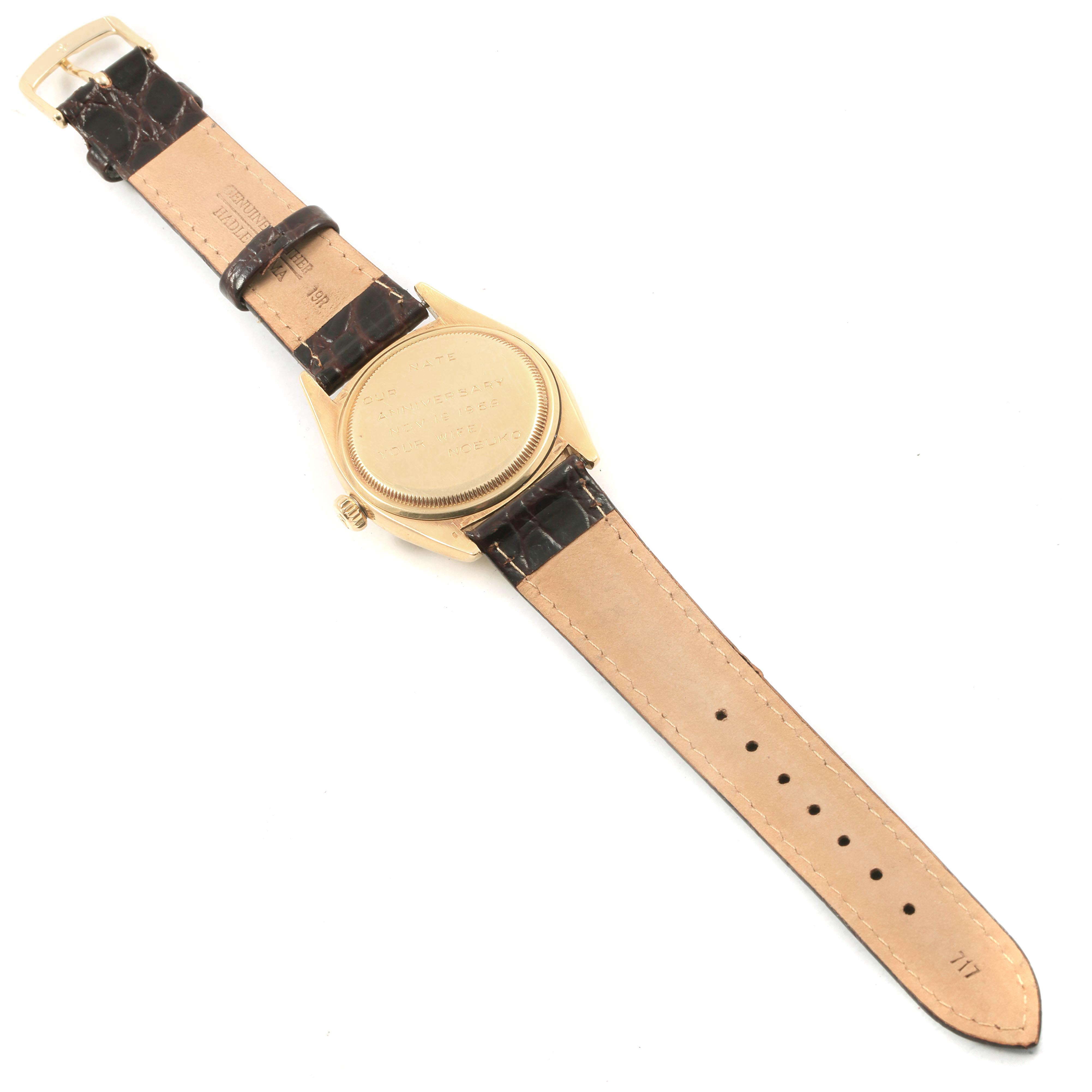 The image shows the back view of a Rolex Vintage Collection 6605 Men's Yellow Gold Champagne Dial 6605 Men's Yellow Gold Champagne Dial watch with a leather strap.