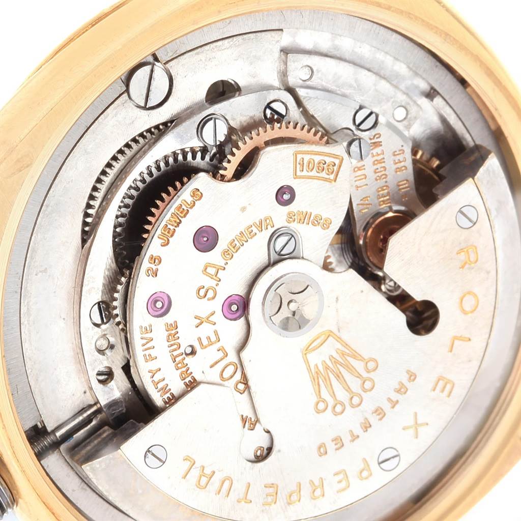 This close-up angle shows the intricate movement and inner components of the Rolex Vintage Collection 6605 Men's Yellow Gold Champagne Dial 6605 Men's Yellow Gold Champagne Dial watch.