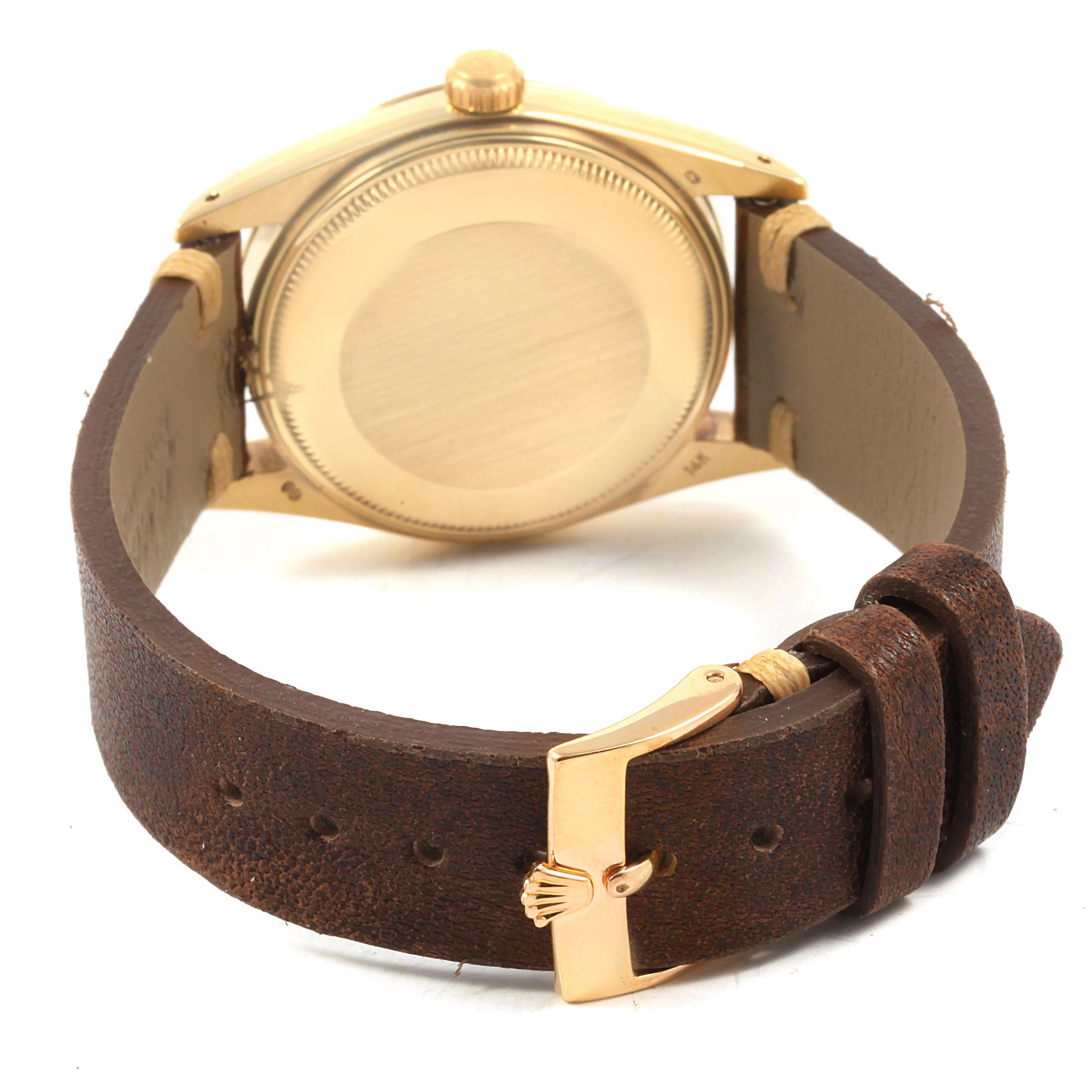 The image shows the back view of the Rolex Vintage Collection 15037 Men's Yellow Gold Champagne Dial 15037 Men's Yellow Gold Champagne Dial watch, highlighting the case back and brown leather strap with buckle.