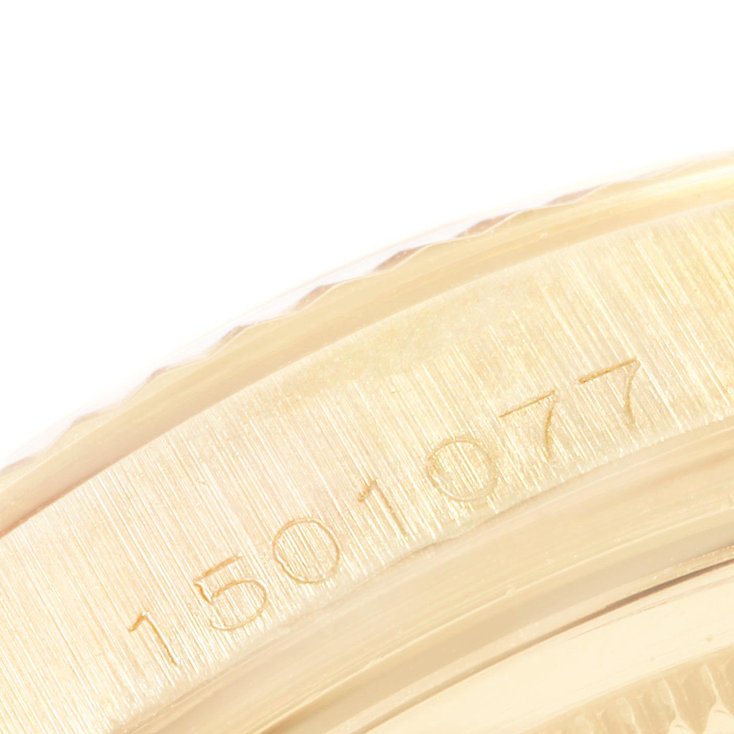 This close-up image shows the engraved serial number on the side of a Vintage Collection model watch by Rolex.