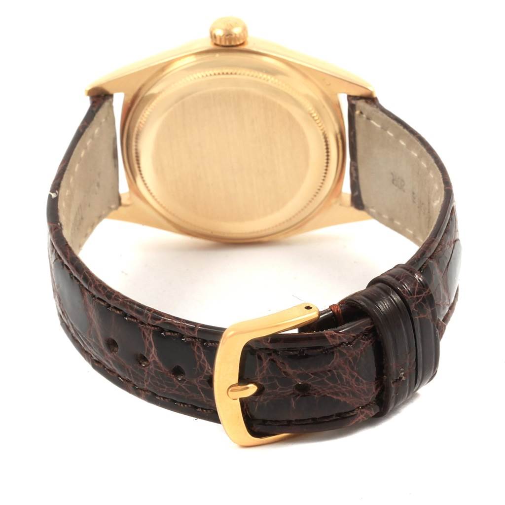 The image shows the back side and strap of the Rolex Vintage Collection 1601 Men's Yellow Gold Champagne Dial 1601 Men's Yellow Gold Champagne Dial watch.