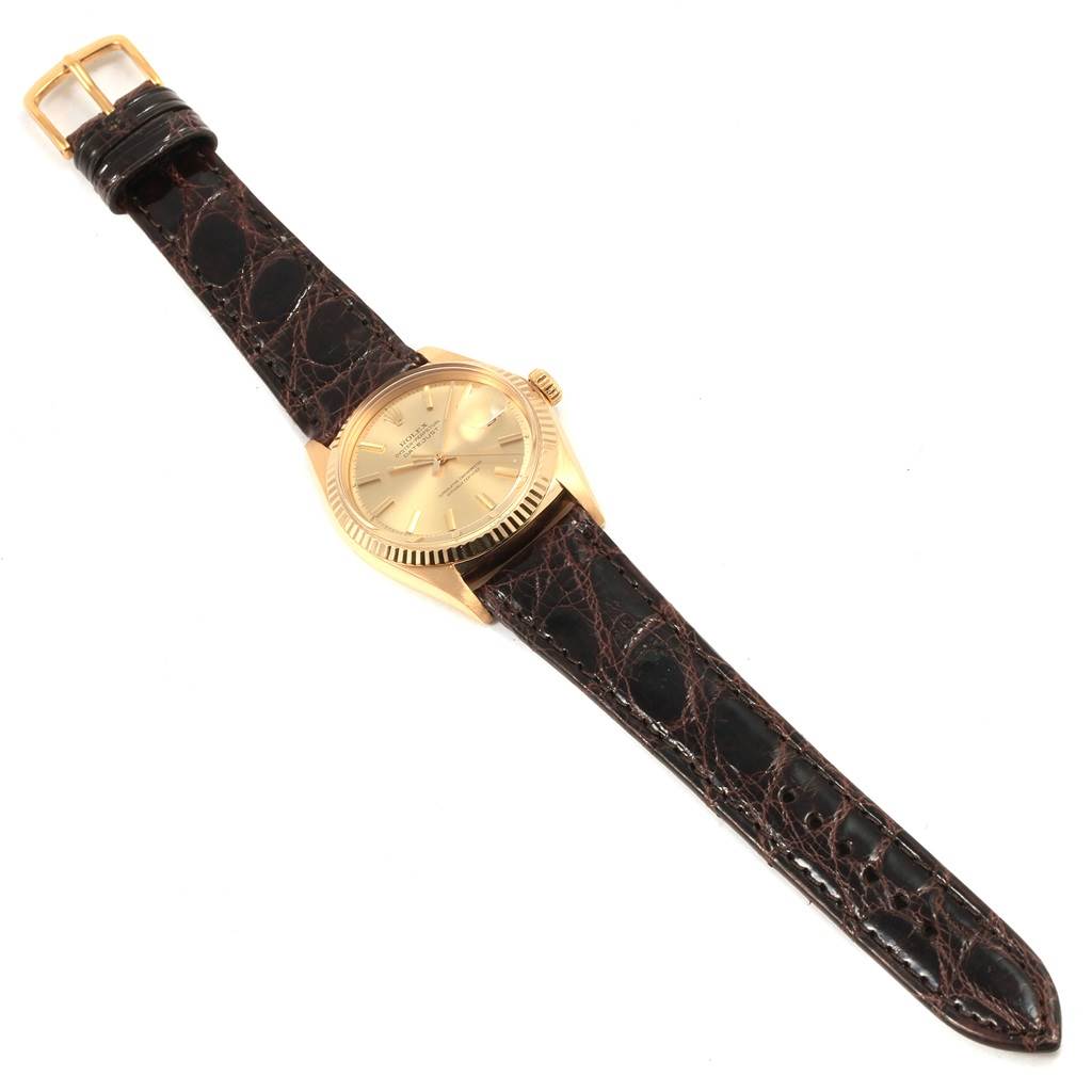 This image shows the face and strap of a Rolex Vintage Collection 1601 Men's Yellow Gold Champagne Dial 1601 Men's Yellow Gold Champagne Dial watch, displayed from an overhead angle.