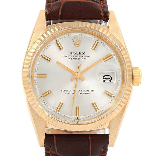 The image shows a close-up of the Rolex Vintage Collection 1601 Men's Yellow Gold Silver Dial 1601 Men's Yellow Gold Silver Dial Oyster Perpetual Datejust watch, featuring its face, bezel, crown, and leather strap.