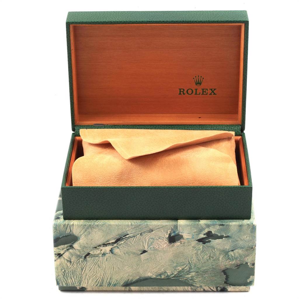 The image shows the opened wooden box of a Vintage Collection Rolex watch, revealing the inner compartment covered with a cloth.