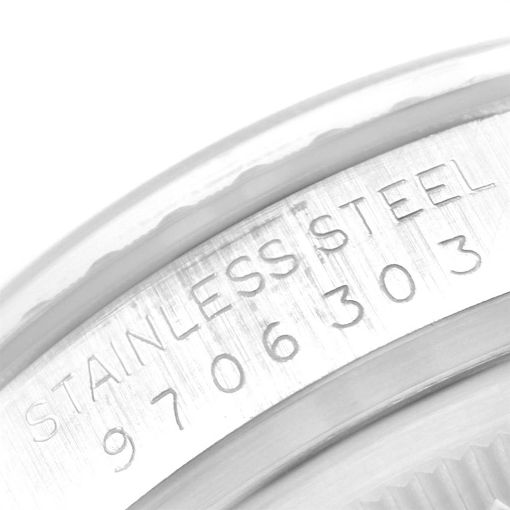 This close-up image shows the stainless steel casing with the engraved serial number of a Vintage Collection model by Rolex.