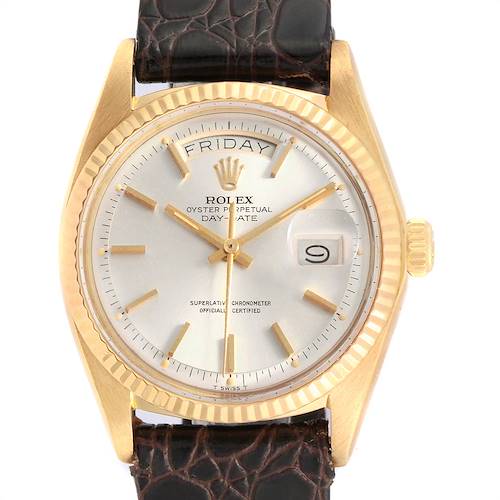 The image shows a front view of the Rolex Vintage Collection 1803 Men's Yellow Gold Silver Dial 1803 Men's Yellow Gold Silver Dial watch, featuring a gold bezel, a leather strap, and a silver dial displaying the day and date.