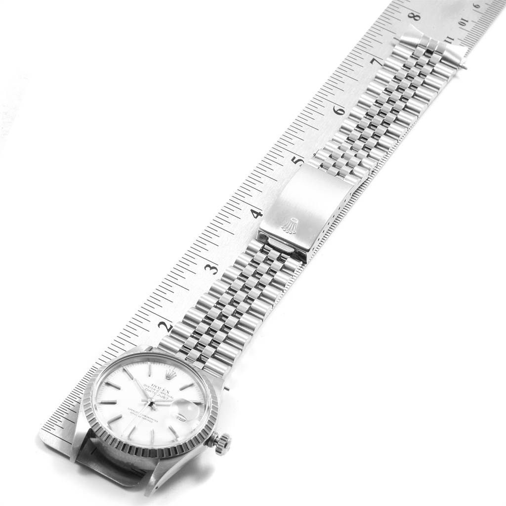 The image shows a top view of a Rolex Vintage Collection 16030 Men's Stainless Steel White Dial 16030 Men's Stainless Steel White Dial watch next to a ruler, displaying the face and bracelet.